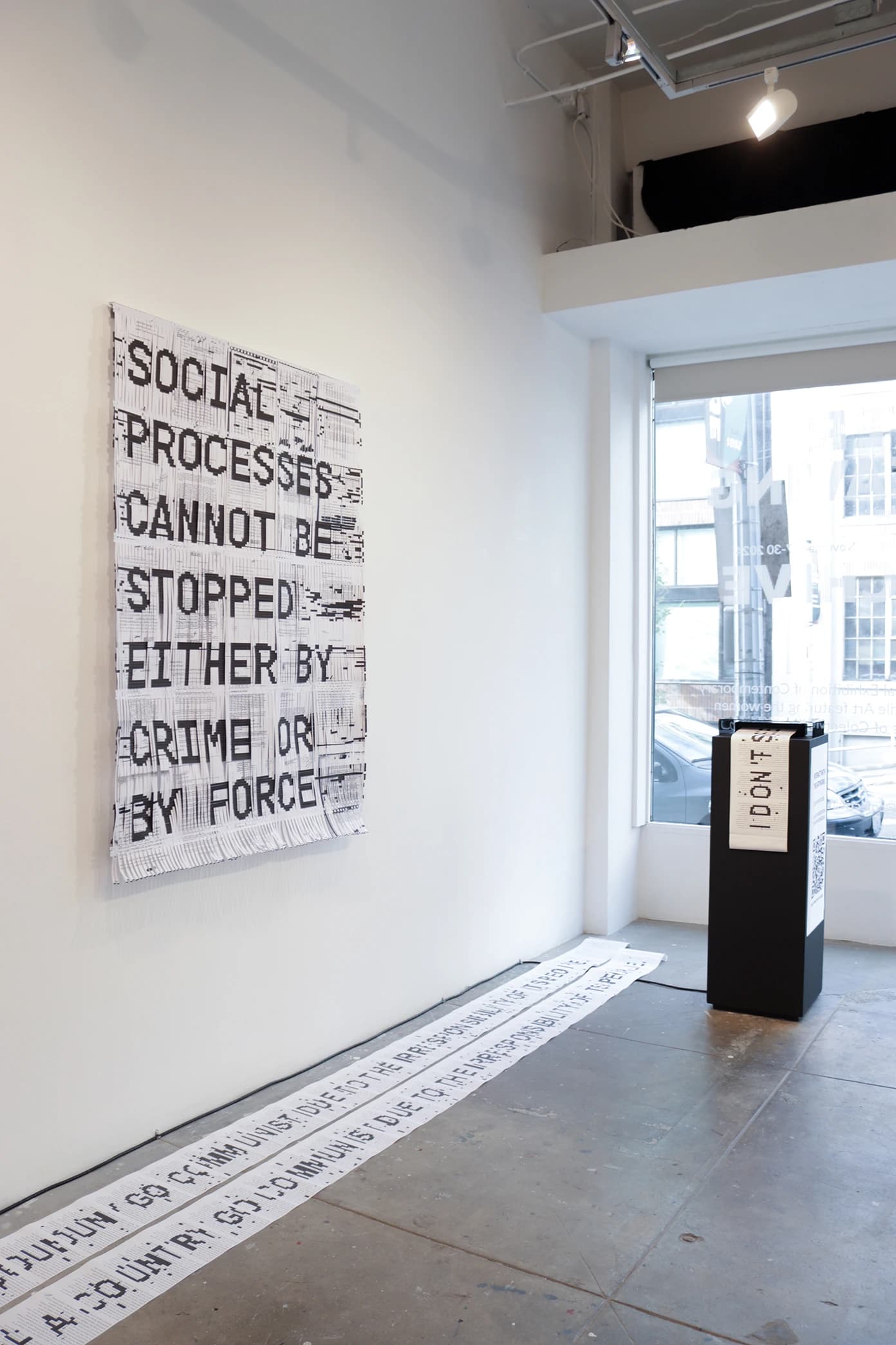 Track II — installation with woven documents and thermal printer station
